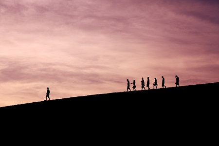 Leading people forward on a hill